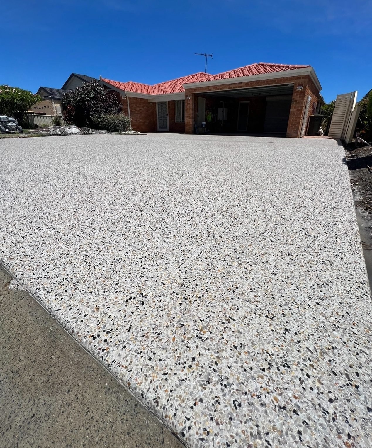 Double width exposed aggregate driveway with a control joint down the centre, Chisholm